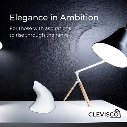 A sleek, white ergonomic Clevisco mouse on a white surface, illuminated by the modern design of an adjustable white lamp with wooden accents. The image conveys a sense of sophistication and ambition, reflecting Clevisco's commitment to elegance and ergonomic design in workspace accessories.