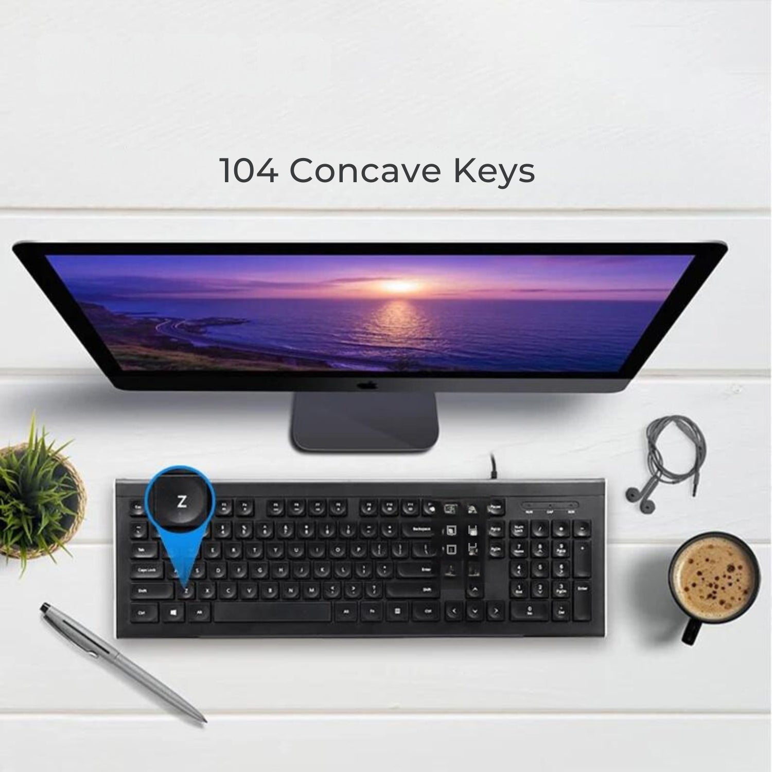 The image shows a Clevisco ergonomic keyboard with 104 concave keys in a clean workspace. The keyboard is under a monitor displaying a sunset. A cup of coffee and headphones are on the desk. The workspace is professional and organized, highlighting the keyboard’s functionality and style.